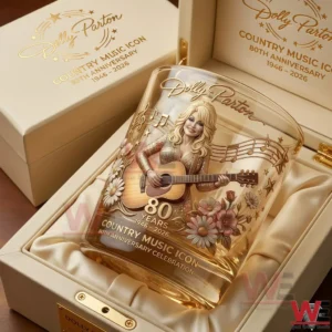 Dolly Parton anniversary glass placed in a refined gift box with floral designs golden details and a classic country music celebration aesthetic!