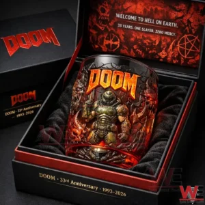 A boxed Doom anniversary collector glass with vivid orange logo and detailed character art displayed in a foam insert!