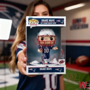 A boxed football themed collectible figure of Drake Maye is held forward by a woman inside an indoor sports setting!