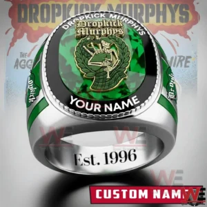 Front view of a silver and green Dropkick Murphys custom ring showing emerald green face crest emblem laurel detail band name custom name space and Est 1996 engraving inside!