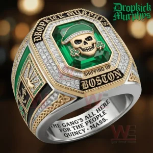 Gold and silver championship ring with a green gemstone face showing a skull wearing a green cap with shamrock accents and the words Dropkick Murphys Shipping Up Boston plus an inner band inscription mentioning Quincy Massachusetts.