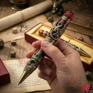 Hand holding a luxury fantasy pen featuring a dragon wrap design with red dice top and detailed castle engravings on the barrel!