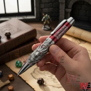 Dungeons and Dragons 52nd Anniversary Edition ballpoint Pen 5 Hand holding a red and silver Dungeons And Dragons themed pen above a parchment map with dice a leather book and miniature figure in the background.