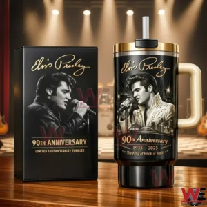 Black and gold Elvis Presley anniversary tumbler with portrait and signature beside a matching black gift box on a stage lit background!