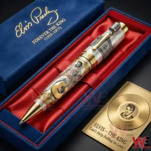 Elvis Presley commemorative pen in a blue gift box with red interior featuring gold accents a guitar illustration and a matching collectible card.
