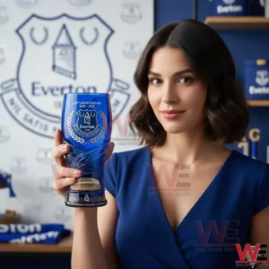 Woman holding a blue Everton 148th anniversary commemorative glass!