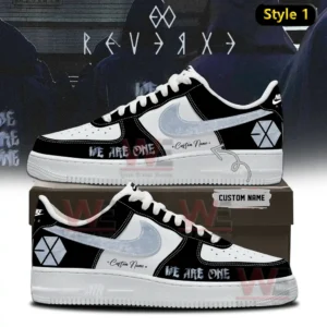 Black and white Nike Air Force one sneaker with light gray swoosh EXO symbol we are one text and custom name shown on a shoebox with dark themed background