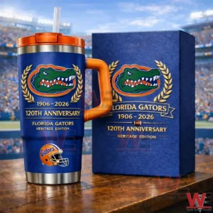 Blue Florida Gators tumbler with orange handle and straw next to a matching 120th anniversary 1906 2026 heritage edition gift box with gator logo and laurel wreath design