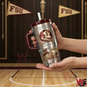 Hands holding a Florida State University insulated tumbler with maroon handle and straw in front of FSU pennants and a basketball court.