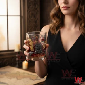 Woman holding a Game of Thrones themed whiskey glass with the Iron Throne design!