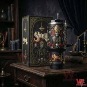 Black gothic handled tumbler with skull and robed figure design next to a matching decorative box on a wooden table!