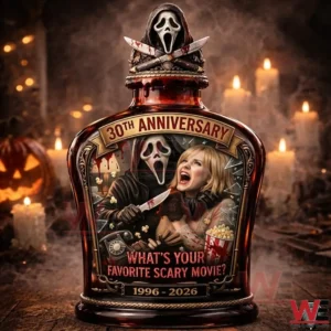 Dark amber anniversary bottle with a masked horror figure label and sculpted cap surrounded by candles and a pumpkin in a spooky scene!