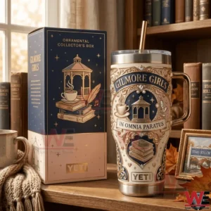 A Yeti tumbler and matching box featuring Gilmore Girls In Omnia Paratus artwork styled in a warm reading room environment!