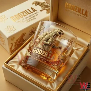 Godzilla anniversary whiskey glass resting inside an elegant gift box with bold creature engraving and cinematic style!