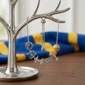 Silver adjustable charm bracelet with Golden State Warriors logo jersey bridge text trophy and basketball charms hanging on a jewelry tree stand.