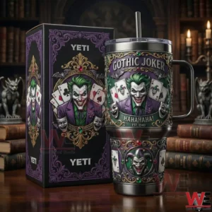 A gothic joker themed tumbler with ornate artwork and playing cards standing next to its decorative box in a dark vintage library setting!