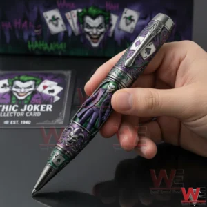Hand holding a Gothic Joker pen with purple green artwork ornate details and playing card symbols in front of themed packaging and a collector card.