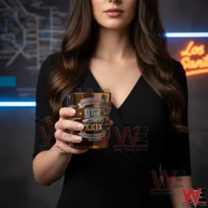 Woman holding a premium gaming themed whiskey glass in a stylish setting!