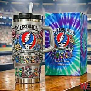 Grateful Dead anniversary tumbler with skull logo roses and dancing bears beside a colorful tie dye gift box on a wooden table!