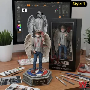 Guitarist collectible with wings posed on a round base next to a boxed display in a creative studio setting!