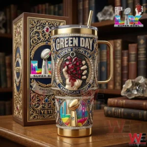 Green Day Super Bowl LX American Idiot tumbler with ornate gold design and matching display box on a wooden table!