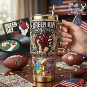 Hand holding a Green Day Super Bowl LX American Idiot tumbler with football themed background decorations!