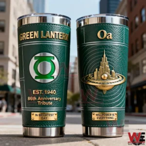 Two Green Lantern insulated tumblers with green textured exterior gold lettering anniversary tribute ring emblem and a three dimensional Oa city design displayed on a city street!