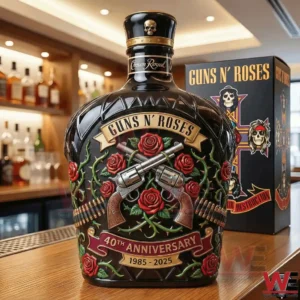 A detailed Guns N Roses commemorative whiskey bottle with sculpted glass rich colors rose motifs revolvers and a premium bar background!