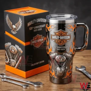 Harley Davidson anniversary insulated tumbler with flame graphics beside a matching gift box on a wooden table with metal tools!