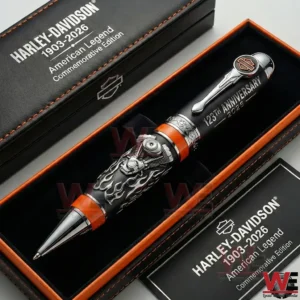 Harley Davidson anniversary collectible pen displayed in a black presentation box with engine inspired design and bold metallic accents!