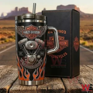Harley Davidson Motorcycles 1903 Yeti Tumbler 5 Harley Davidson insulated tumbler with handle and straw next to a branded box on a wooden table with a road trip desert background!