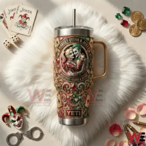 A decorated stainless steel tumbler with colorful Harley Quinn and Joker illustration placed on a white fur surface with themed accessories!