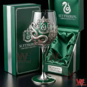 A Slytherin inspired wine glass displayed with a green presentation box and detailed crest design!