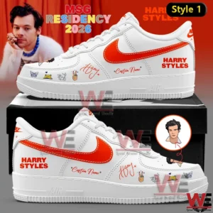 A white customized low top sneaker with an orange side logo illustrated icons near the front a handwritten style signature and printed text on the side resting on a black box with a red background that includes promotional wording and a portrait image!