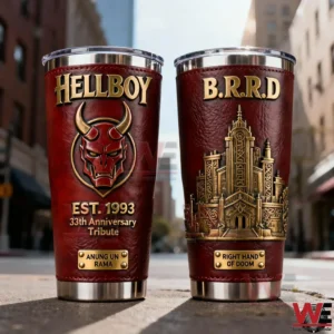Two Hellboy inspired tumblers with red and gold design demon emblem BPRD building artwork and polished metal base placed on an urban street background!