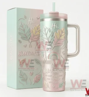 Pastel insulated tumbler with handle and straw and matching box featuring leaf heart and rainbow artwork on a white background!