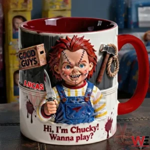 A close view of a horror doll themed ceramic mug displayed on a tabletop with collectible items in the background!