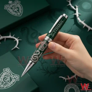 Harry Potter Hogwarts House Collector’s Edition Pen 3 A hand holding a green Slytherin collectible pen with serpent design crest engraving and themed background!