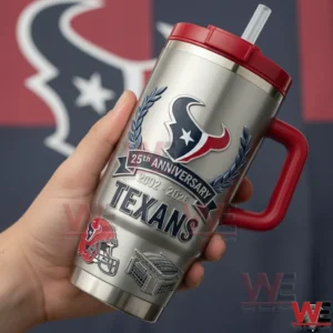 Hand holding a silver Houston Texans twenty fifth anniversary insulated tumbler with red handle and straw in front of a blurred team logo background!