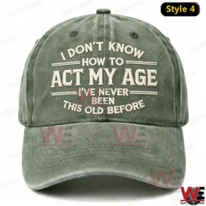 I Don't Know How To Act My Age I've Never Been This Old Before Embroidery Cap 11 A front facing olive green baseball cap with embroidered age themed humor text displayed on a neutral background!