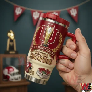 A hand holds a red Indiana Hoosiers tumbler decorated with a trophy symbol team logo and championship celebration elements in a collectible display!