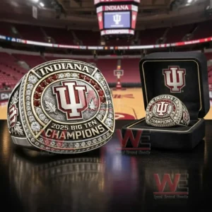 Indiana championship ring with IU logo red and clear stones and 2025 Big Ten Champions text shown with a display box and arena background