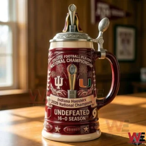 A red and cream Indiana Hoosiers commemorative beer stein displayed on a wooden surface with national championship text trophy top lid and detailed football themed decorations!