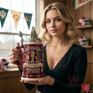 A woman holding a red Indiana Hoosiers championship beer stein with trophy lid design team logos and football themed details in a warmly lit sports themed interior!