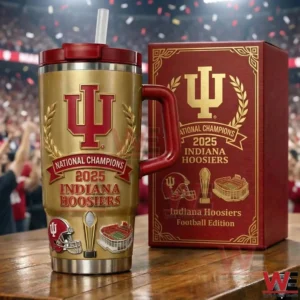A commemorative Indiana Hoosiers National Champions 2025 insulated tumbler with handle straw detailed team graphics and a matching red and gold collector box displayed in a stadium environment!