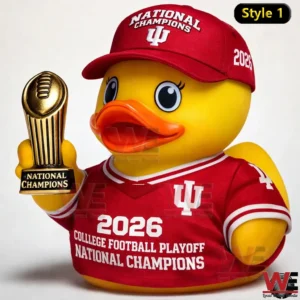 The image presents a yellow rubber duck dressed in a red championship outfit holding a trophy against a clean studio background!