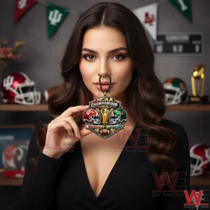 A female model displays an Indiana Hoosiers NCAA Championship 2026 hanging ornament featuring team helmets and a central trophy!