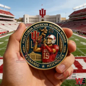 Hand holding a gold and blue commemorative Heisman winner coin with an Indiana football player illustration and an IU stadium in the background!