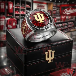 Indiana Hoosiers ring with red gemstone top gold IU logo Hoosier Pride text torch side detail and Hoosier Nation engraving displayed on a black box in a team store!