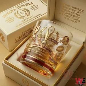 A detailed Indiana Hoosiers championship whiskey glass with gold graphics trophy symbols and a collector style box background!